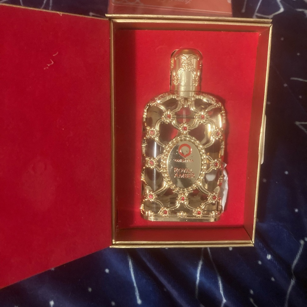 Gold Perfume Bottle with Red Accents